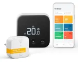 Termostato Tado inteligente con pantalla digital mostrando 20.0°C y app móvil. Un puente de internet incluido.