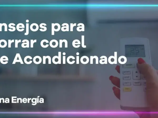 Consejos para reducir el consumo de aire acondicionado. Una mano sostiene un control remoto, mostrando la temperatura.
